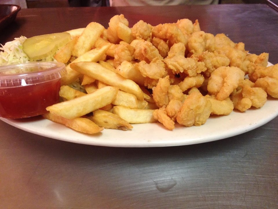 Fried fish served in a cozy dining room.